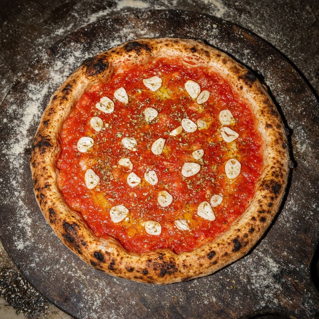 Marinara pizza with tomato, garlic and oregano.